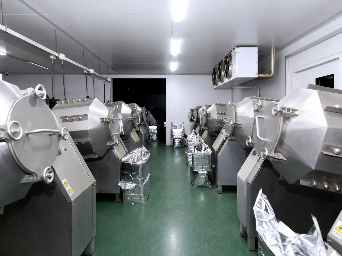 Rows of ball-milling equipment in an owned production facility